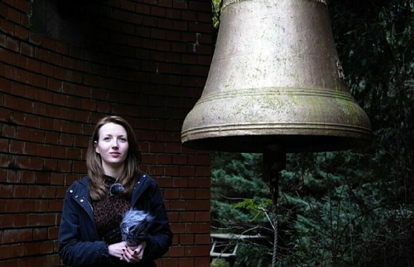 Photo of Wendy Smith with large bell