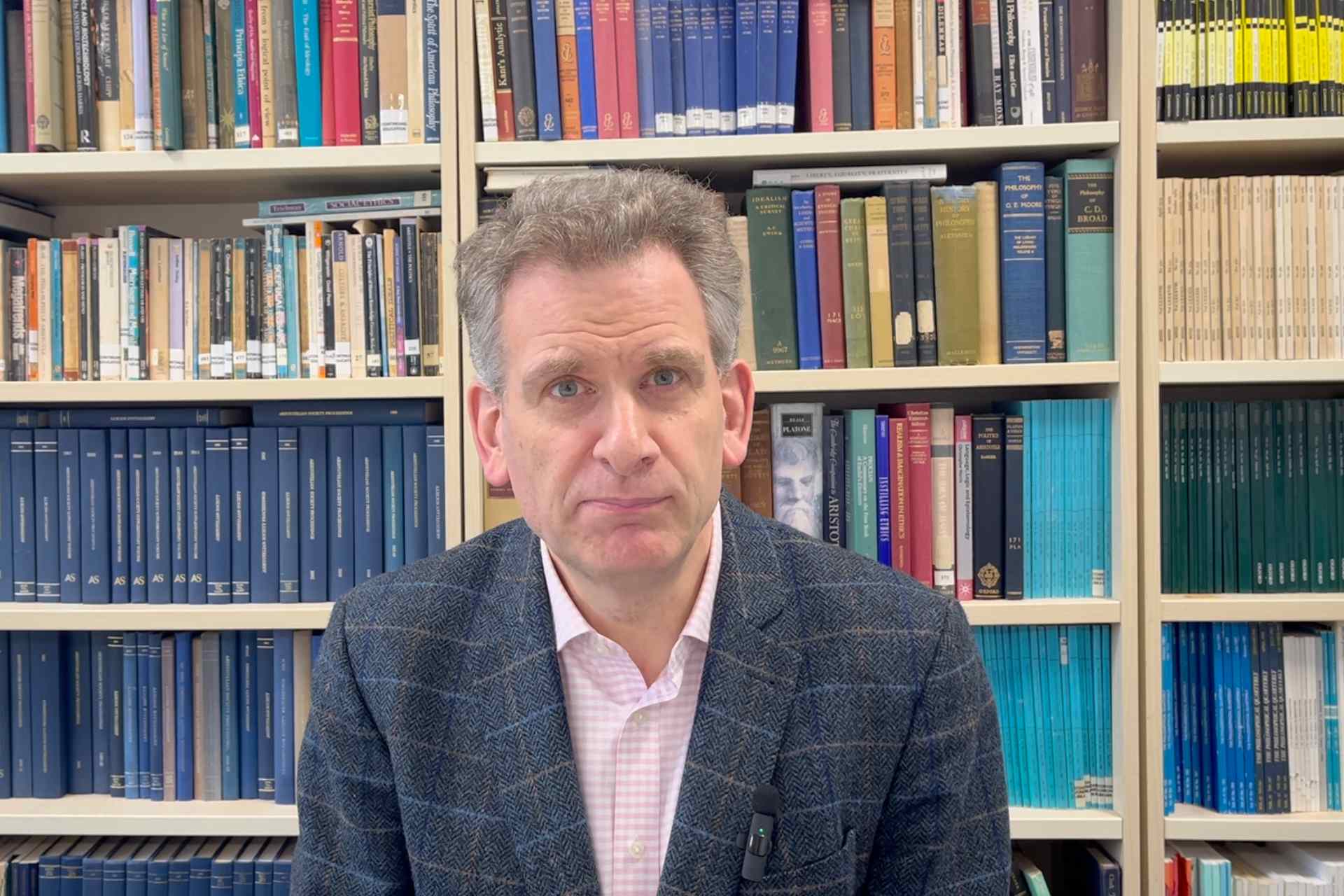 Dr Daniel Hill in the Philosophy library