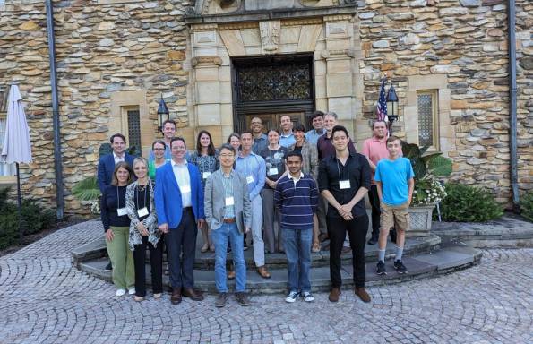 Group photo outside stone building