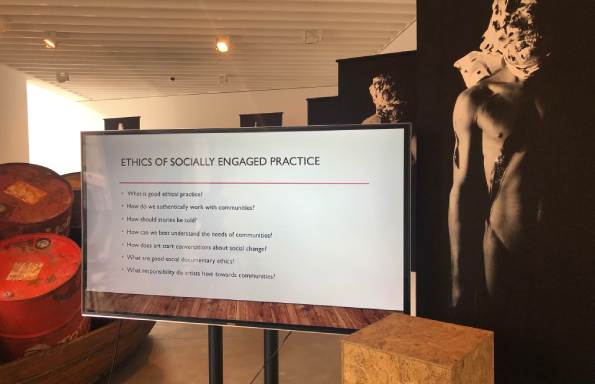 Photo of presentation on screen in gallery