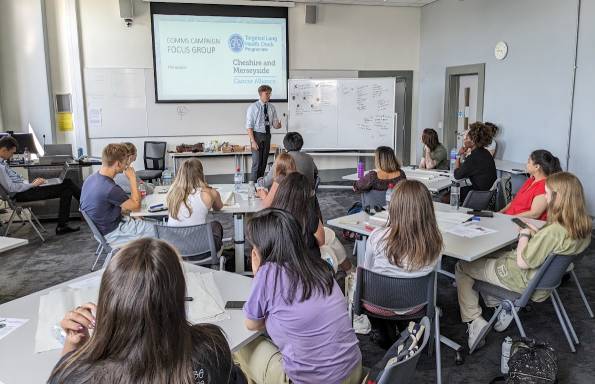 Max Thomasson giving a presentation to students