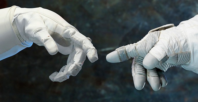 Astronauts touching fingers