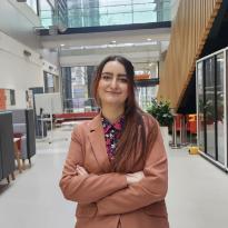 Laura standing in a University building