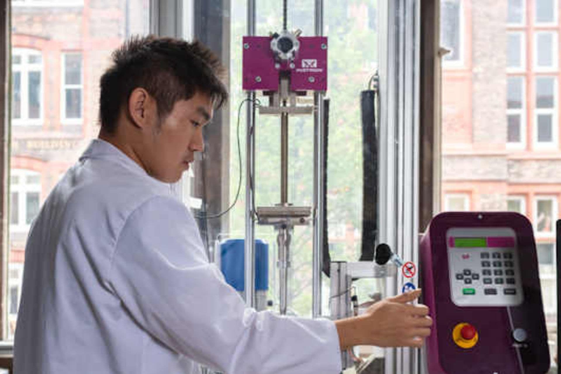 A researcher using lab machinery