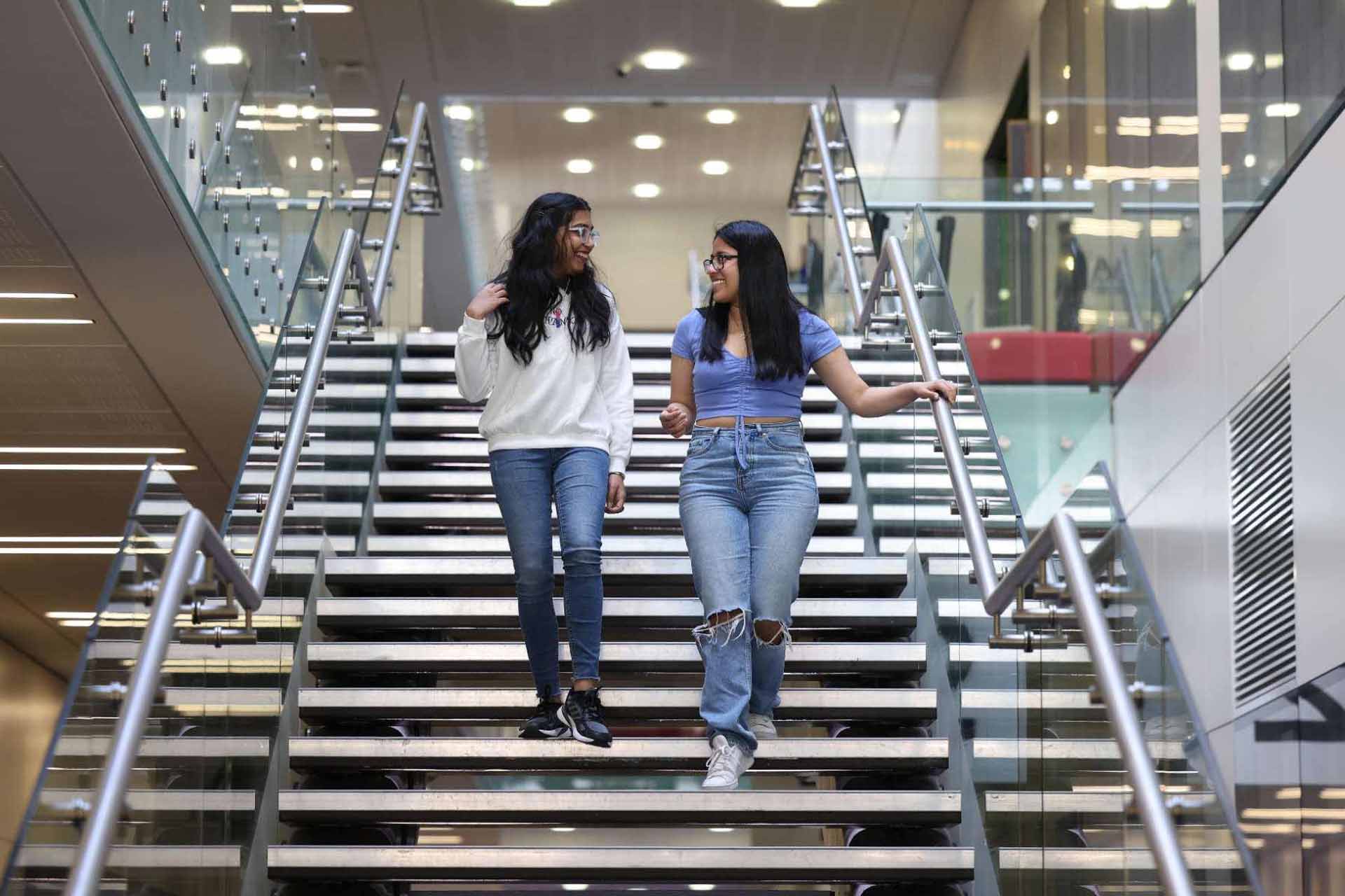 Students walking down stairs in the Central Teaching Hub on campus