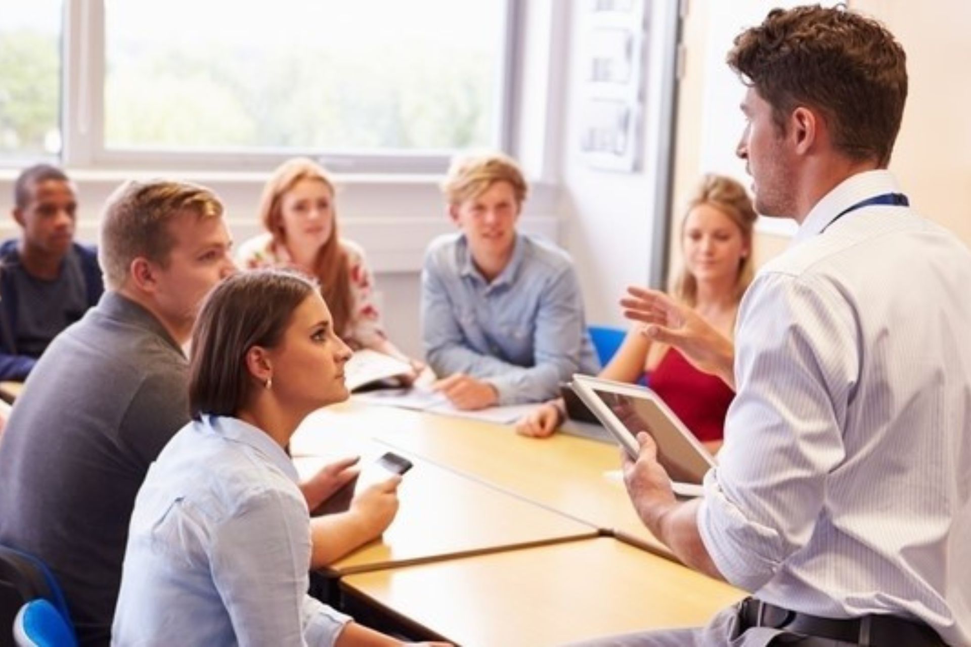 Researchers in a classroom while a lecture takes place