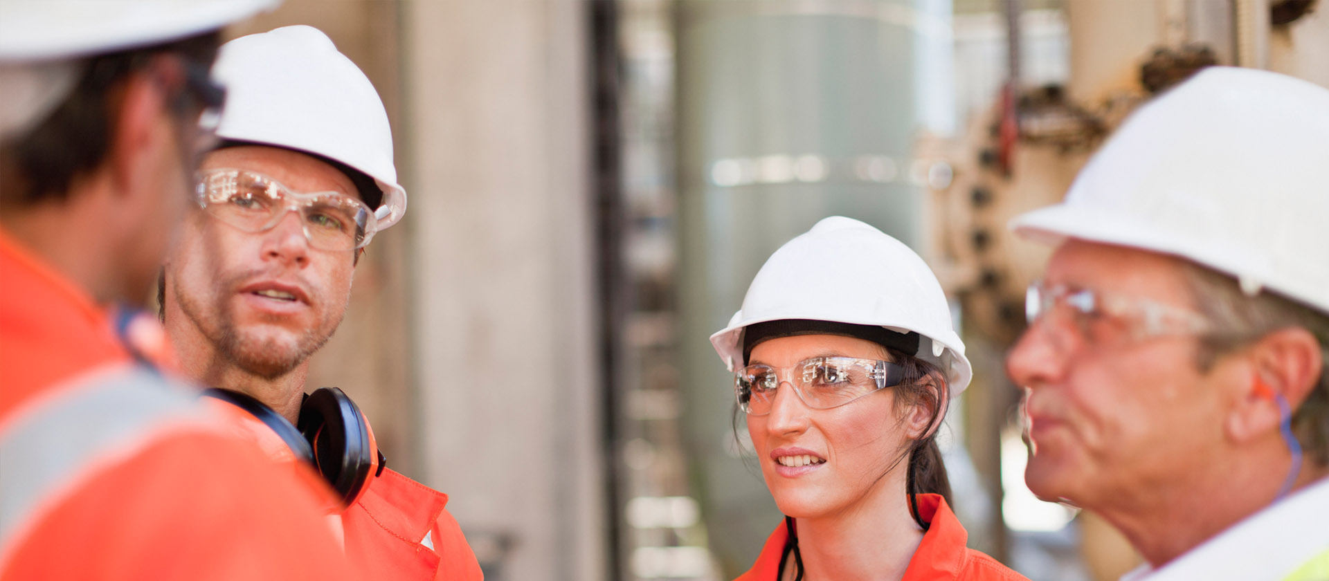 Group of workers in high-vis and hard hats