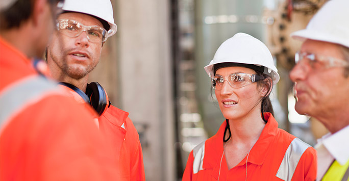 Group of workers in high-vis and hard hats