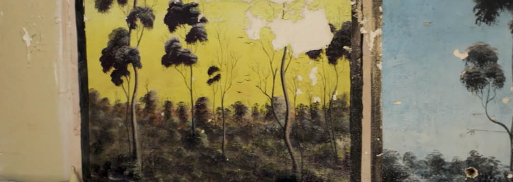 A prisoners' artwork from Fremantle Prison depicting trees on a desert.