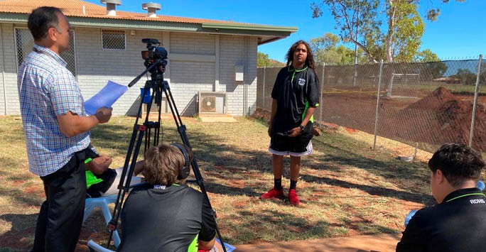 Children learning how to film