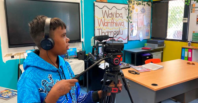 A child learning to film