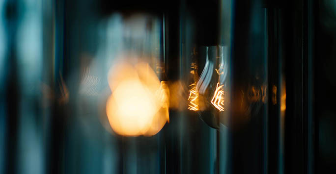Lightbulb distorted in a window.