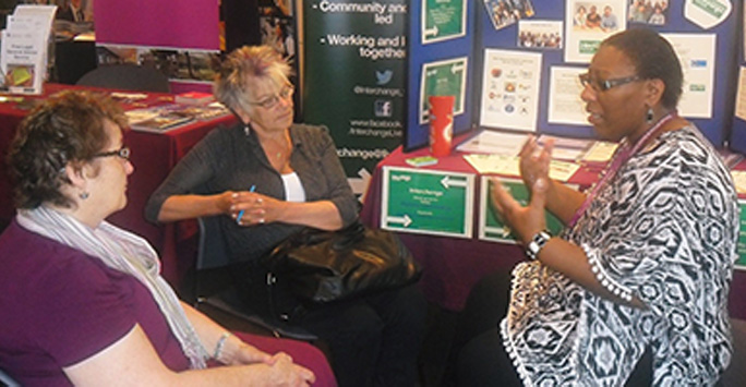 Interchange staff meeting with community group members.