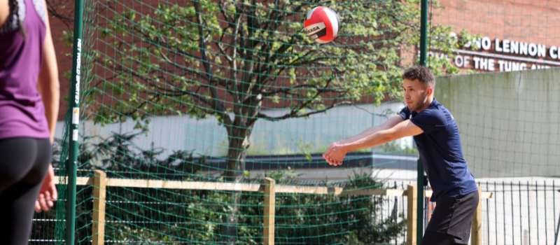 students playing volleyball