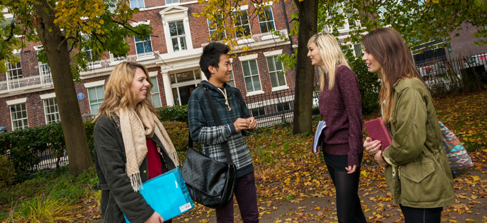 tudents talking together on campus in autumn Abercromby Square.