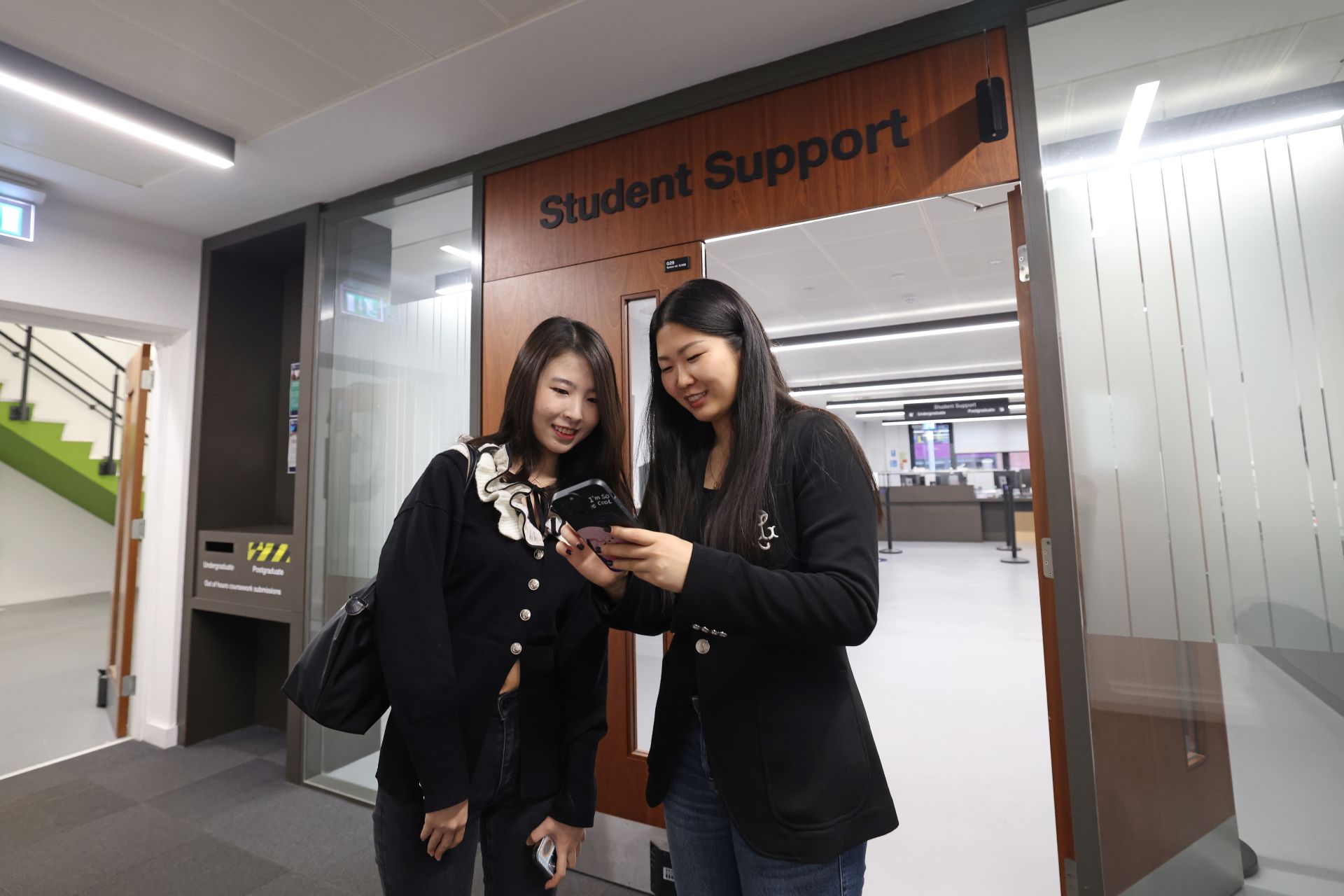 Students standing outside of Student Support reception.