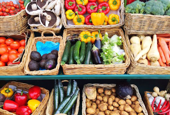Baskets of vegetables on display.