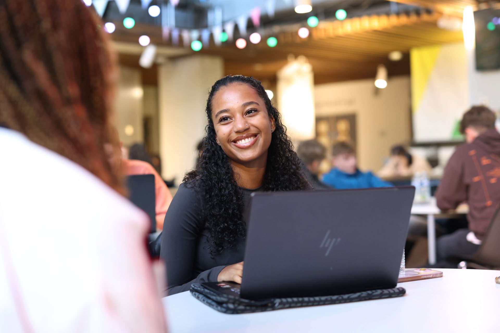 A student using a laptop in the Liverpool Guild of Students.