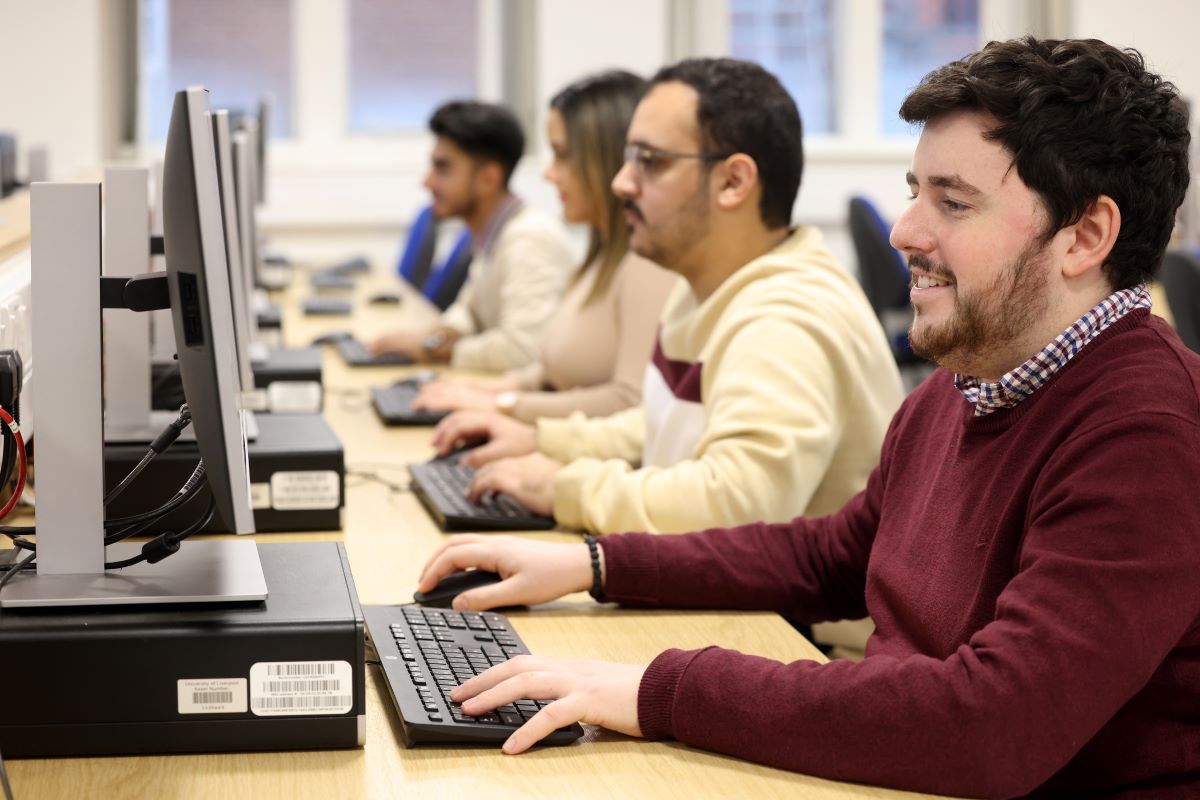 Computer science student working on computer