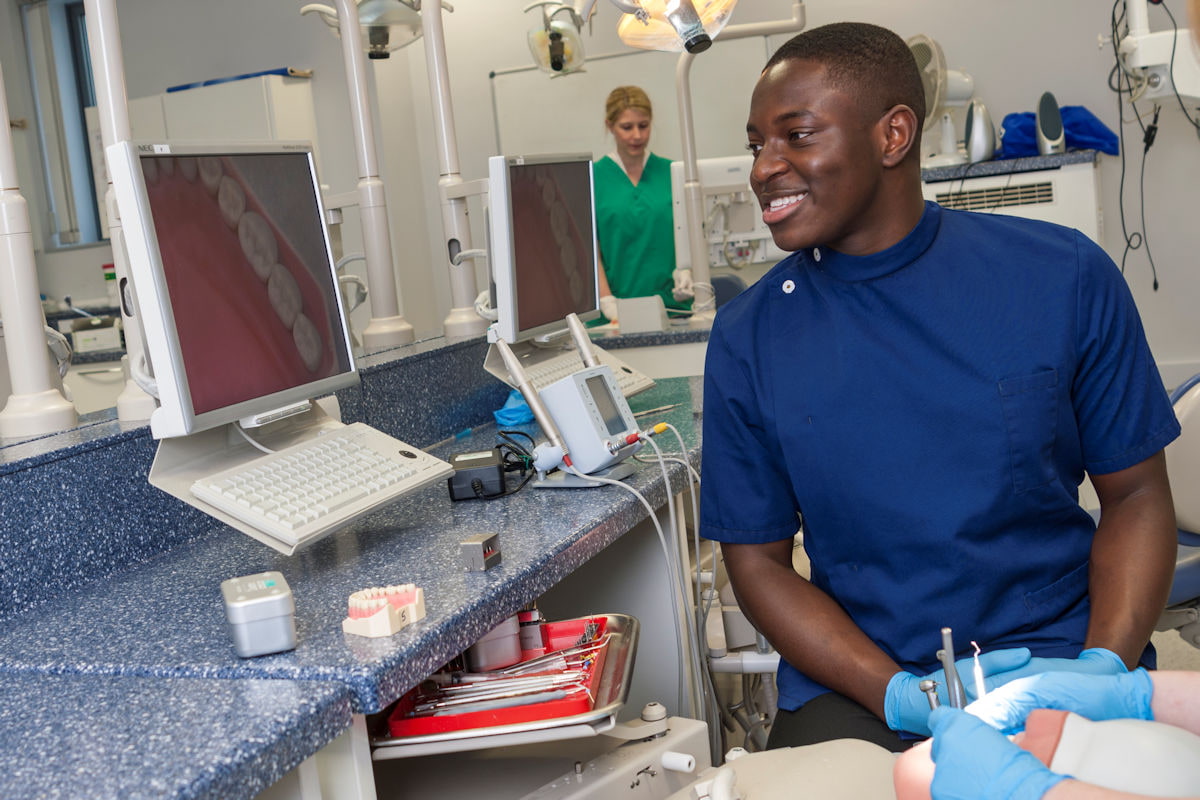 Dentistry student looking at screen in lab