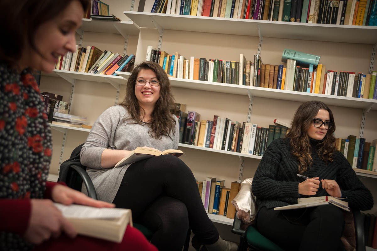 Three English students in a seminar