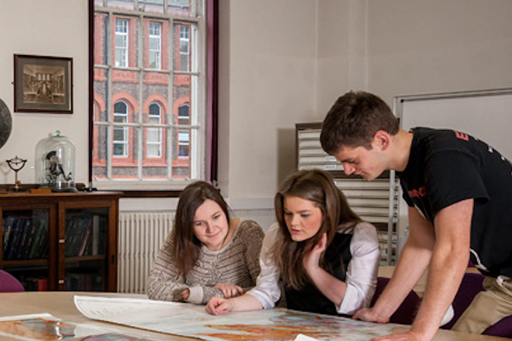 A student examines an artefact