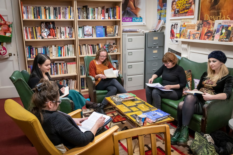 A group of students sitting down for a discussion in a common space