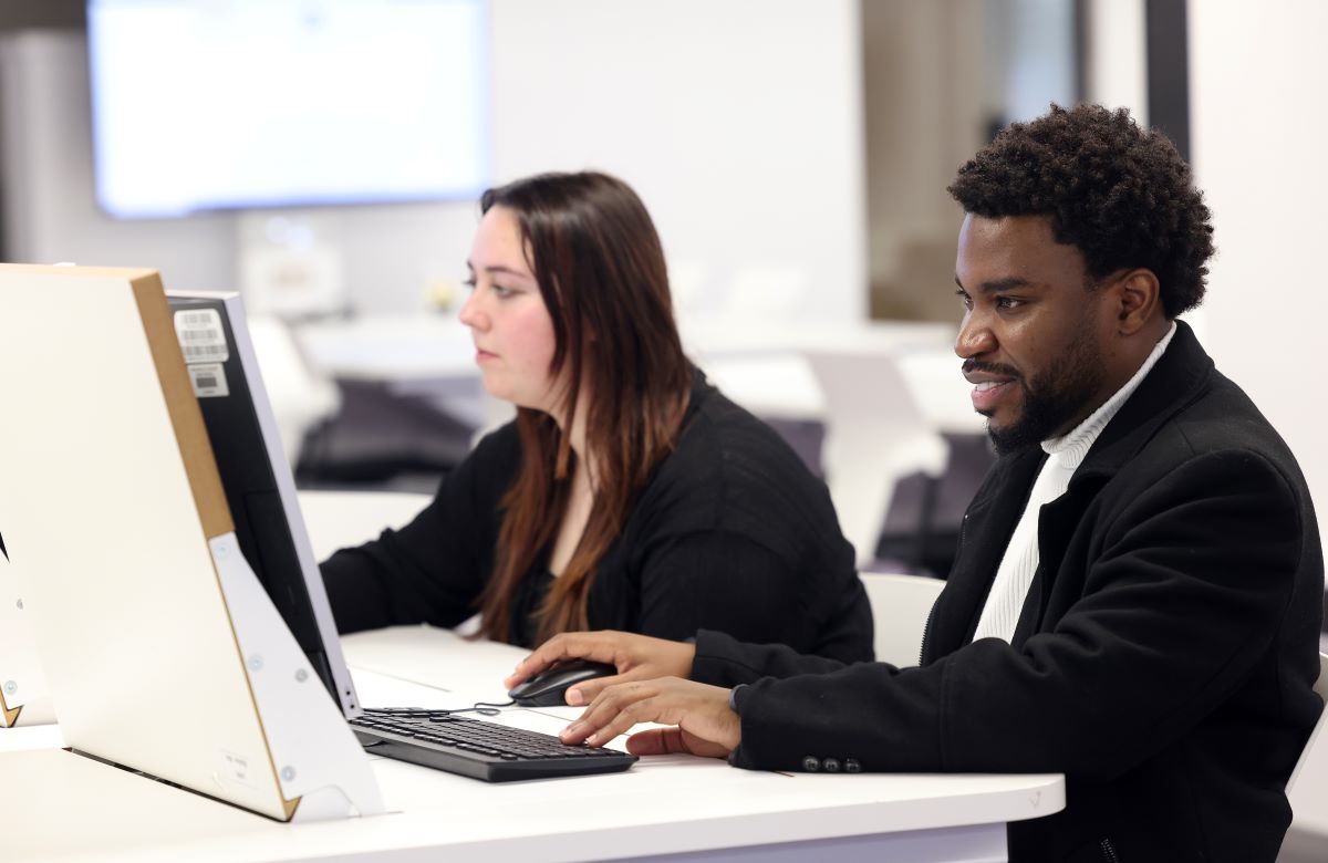 Law studying social justice in computer lab