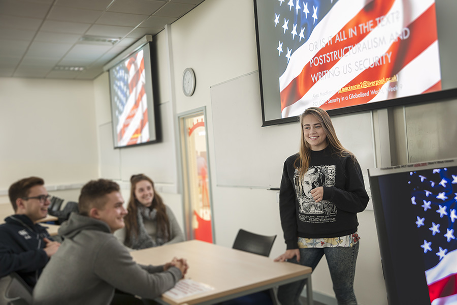 Politics students in room in front of presentation screen