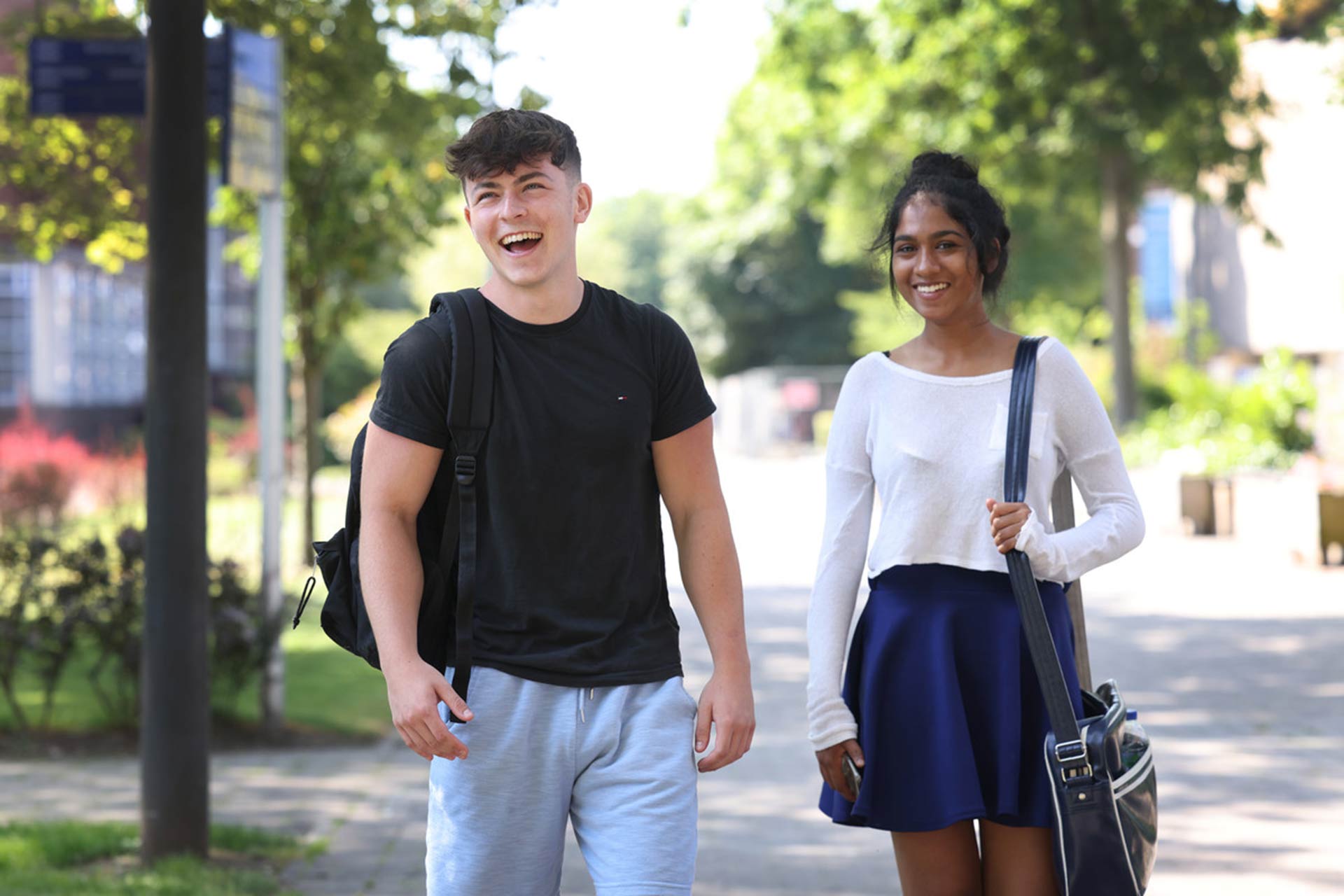 Two students walking through campus.
