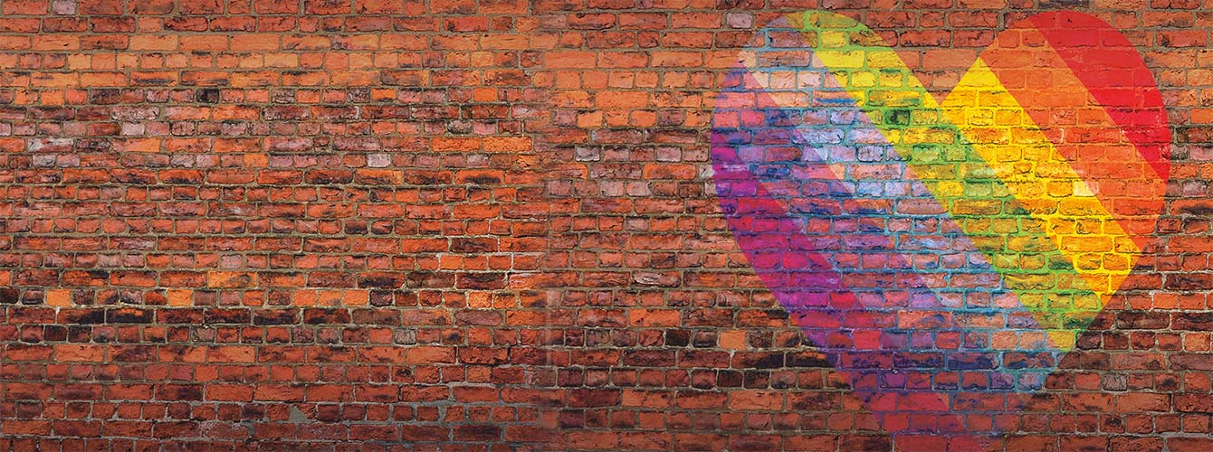 Rainbow heart on a brick background