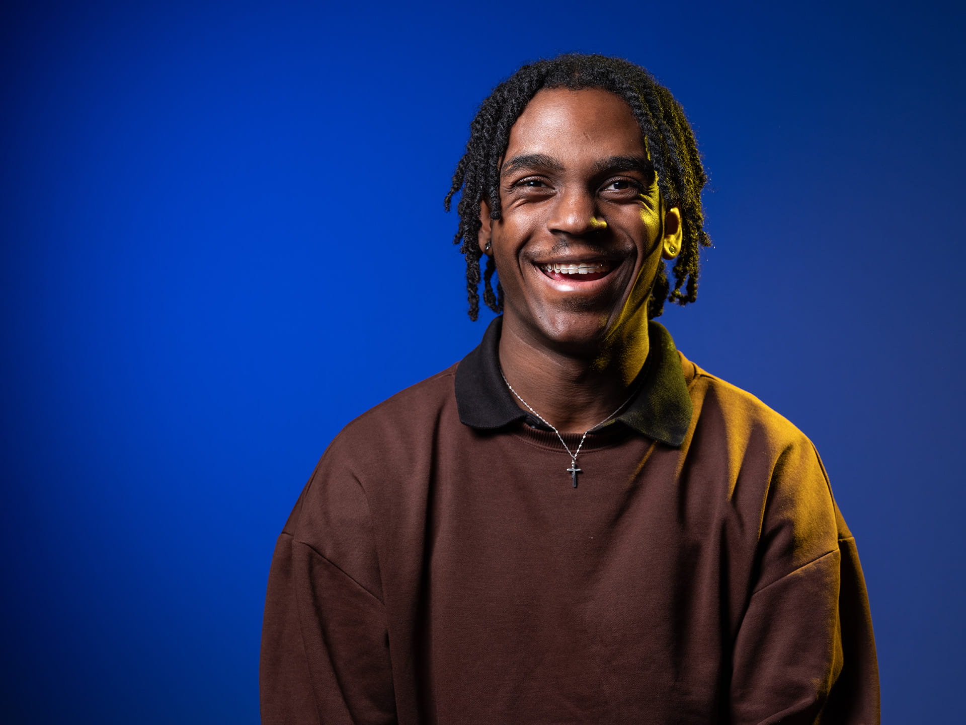 Image of a male student smiling.