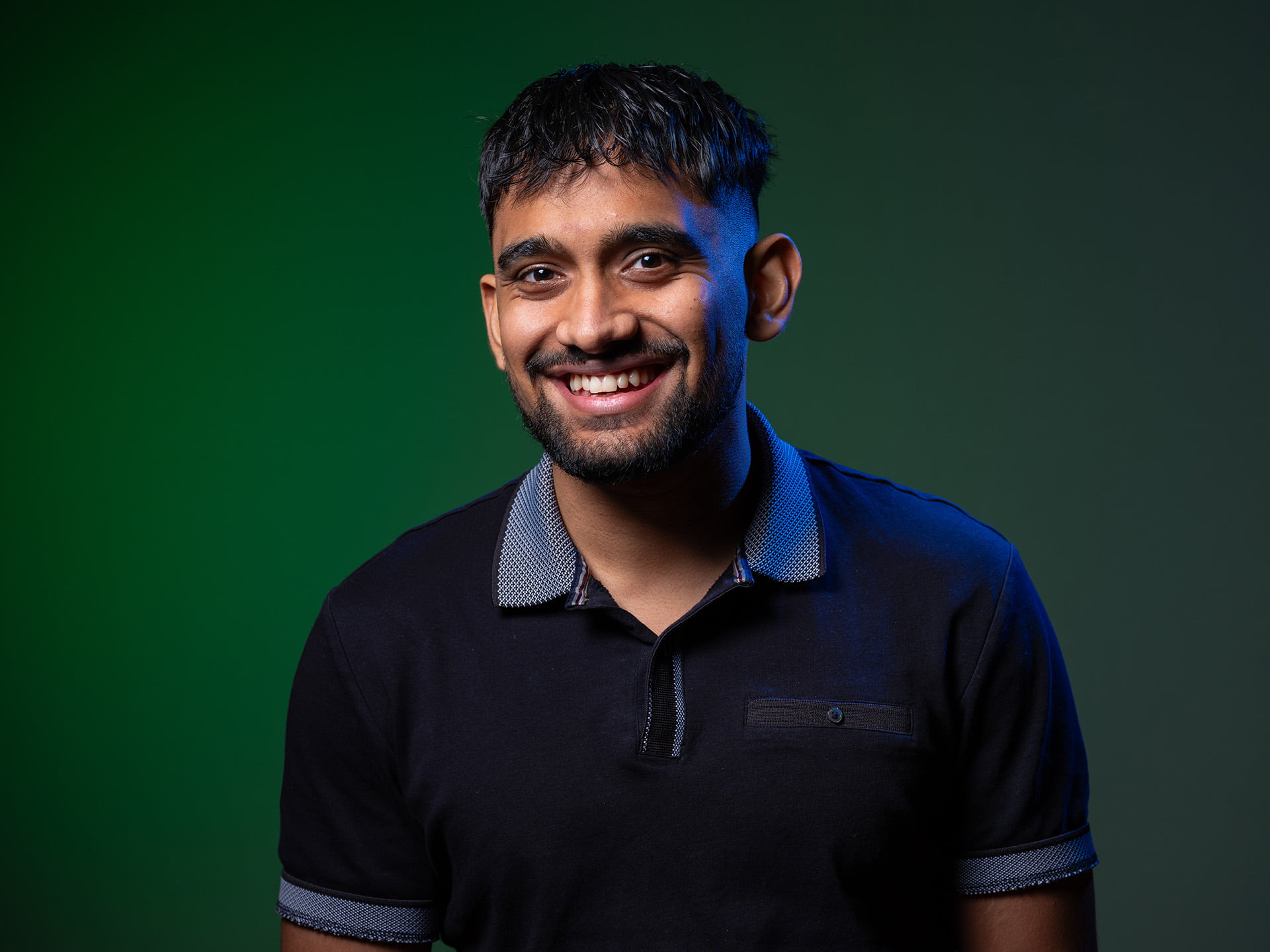 Image of a male student smiling.