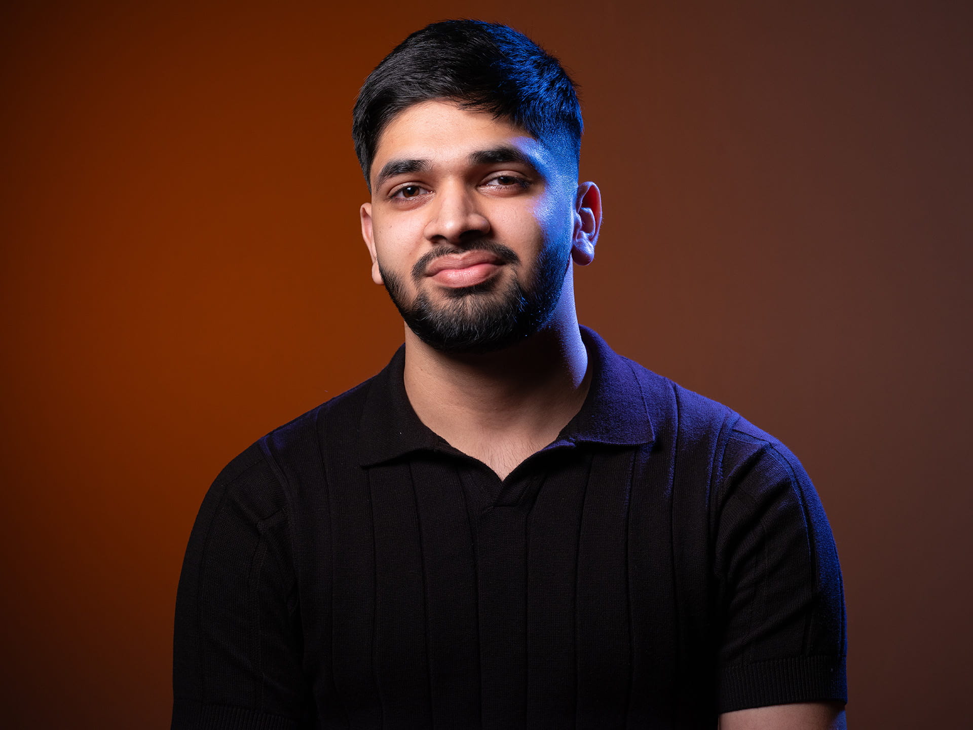 Image of a male student smiling.