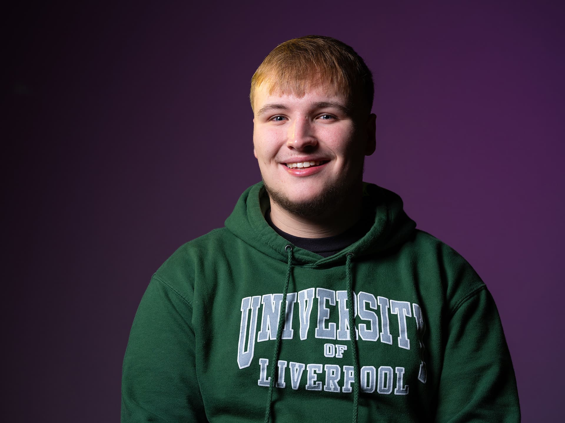 Image of a male student smiling.