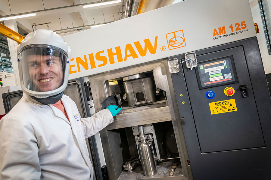 A scientist using a machine in the lab