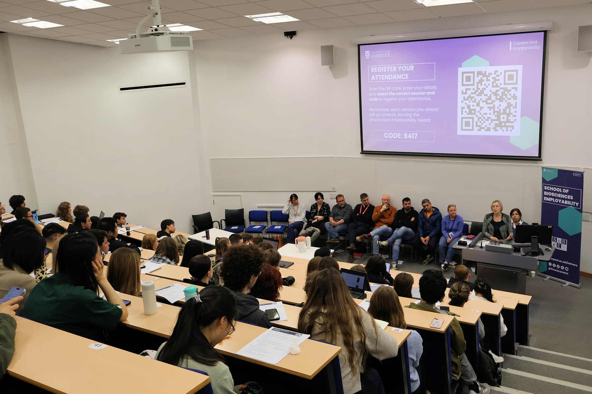 A photo taken from the back of a packed lecture theatre for Biosciences Employability Week