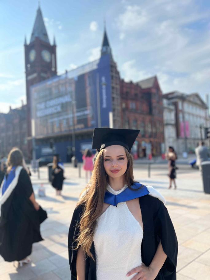 Ivana Kobakova in University square after graduation, the Victoria Gallery and Museum in the background