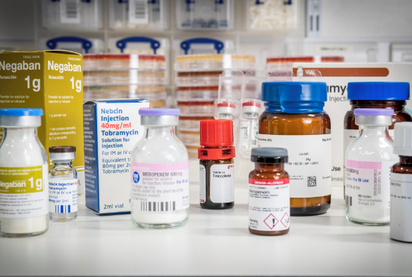 A collection of different medicine bottles on a laboratory bench