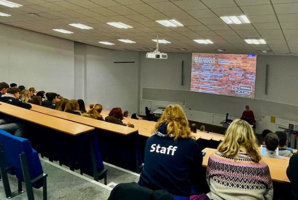 Pupils watching a presentation in a lecture theatre