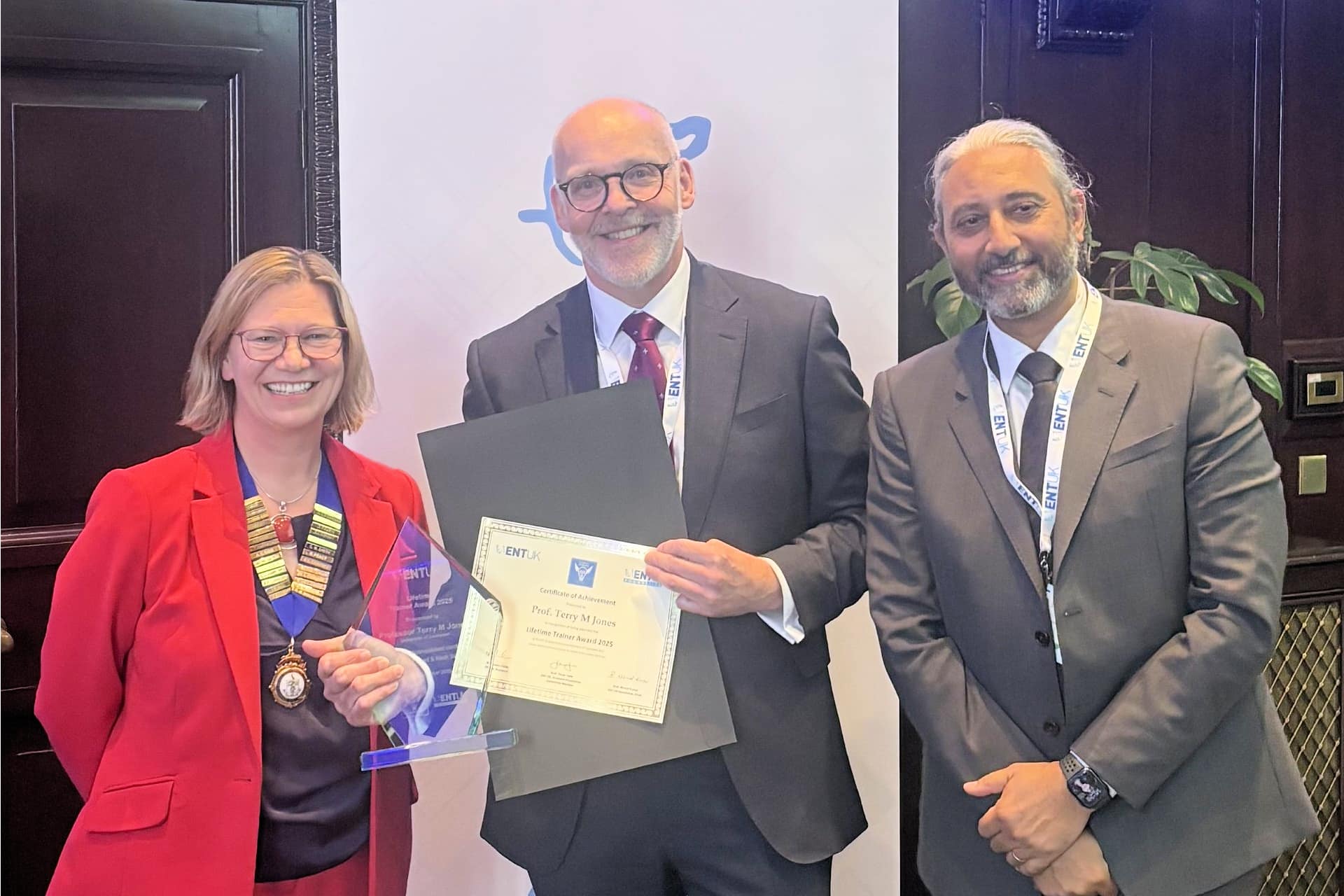 Professor Terry Jones receiving the Lifetime Trainer Award and certificate