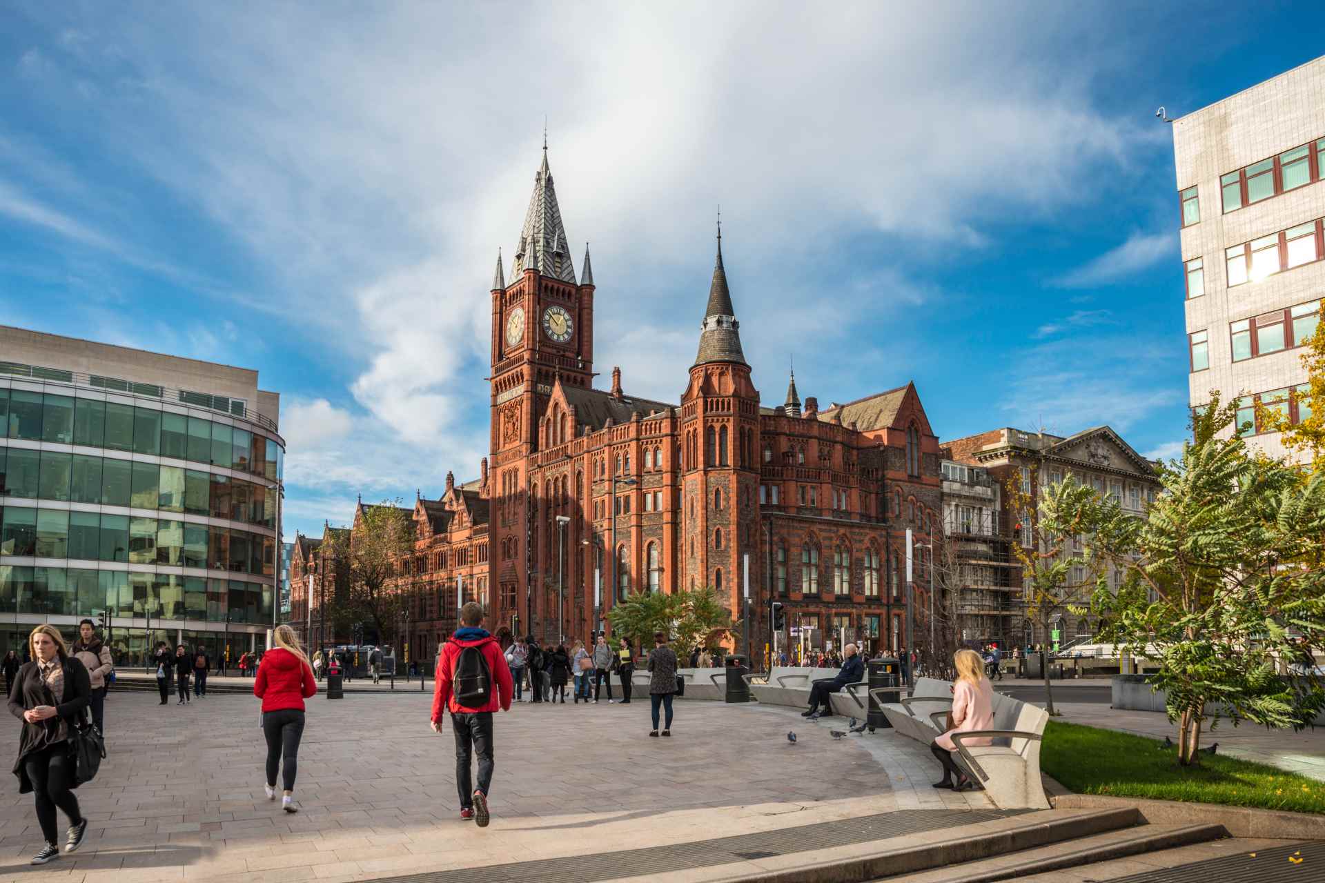 An exterior shot of the Victoria Gallery & Museum and students walking across University Square.