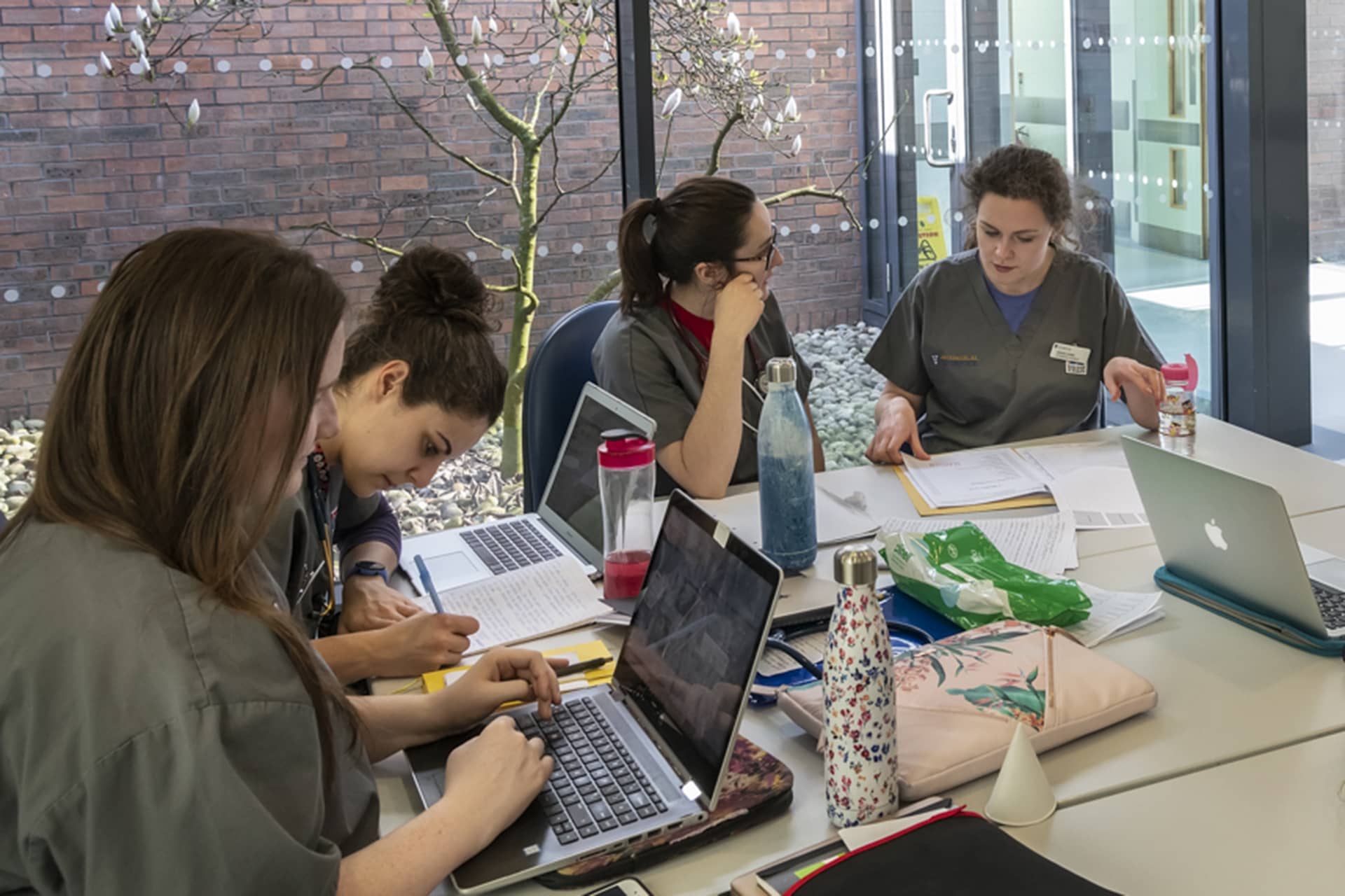 Students working around a table