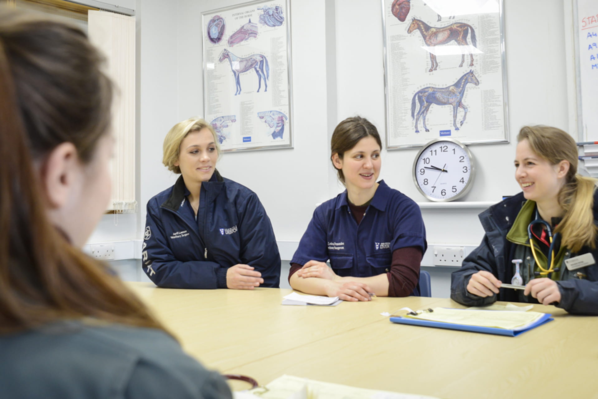 Students talking around table