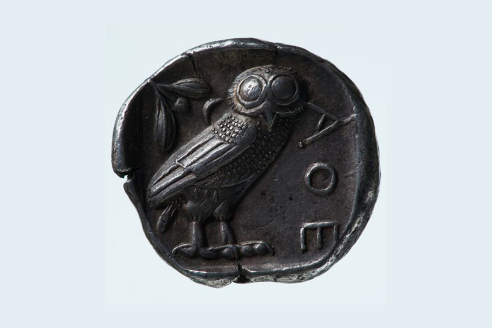 Ancient coin with an owl