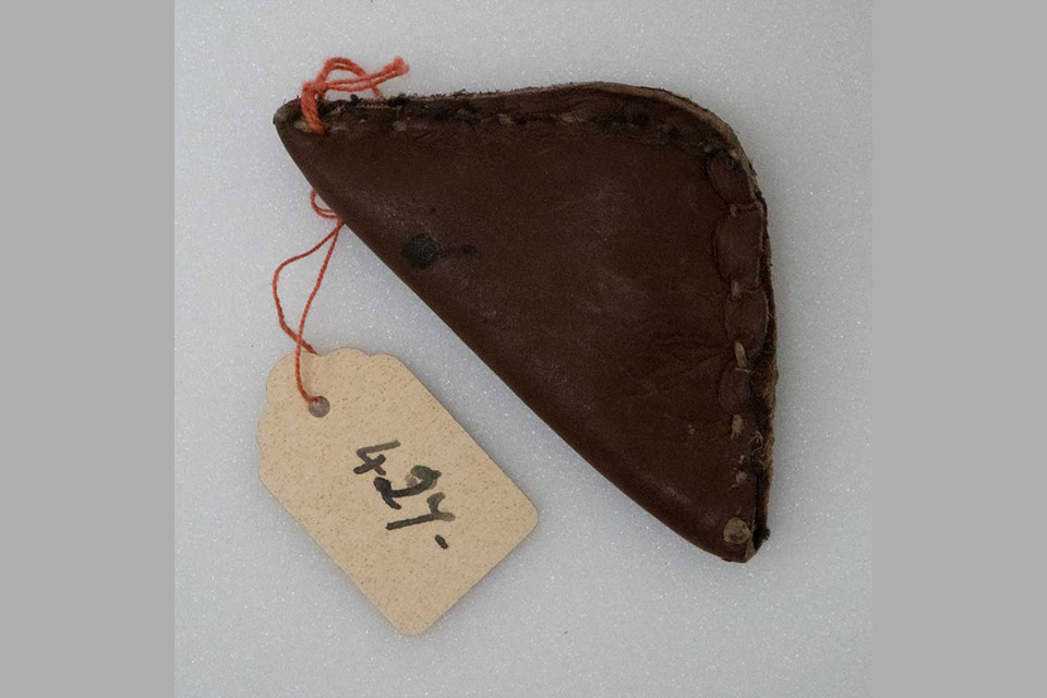 Small leather pouch with an item label