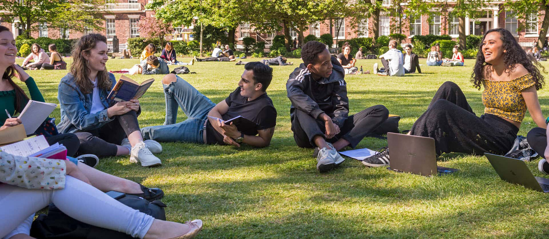 Students sitting in Abercromby Square at the University of Liverpool