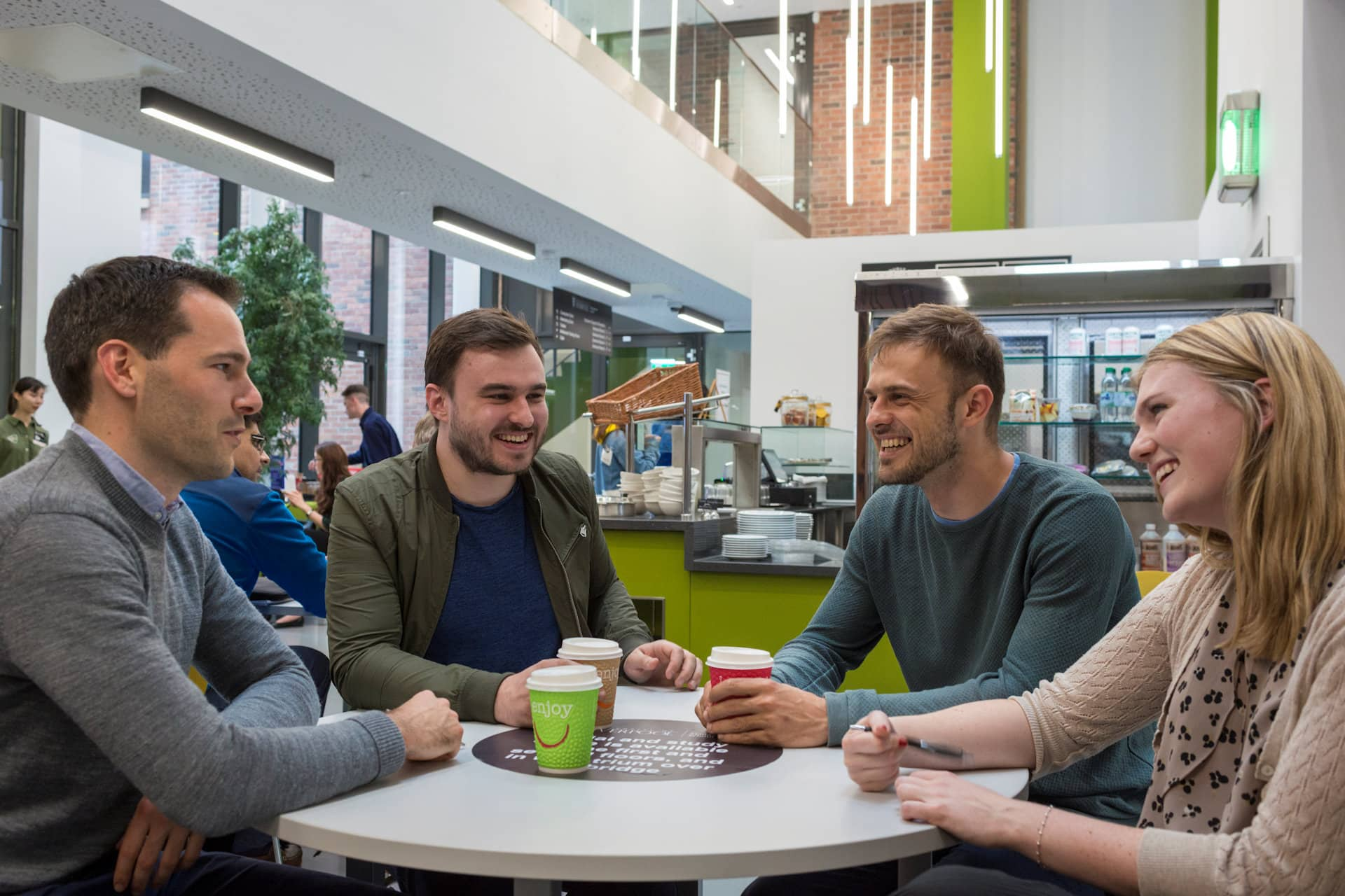 Students sitting at table chatting