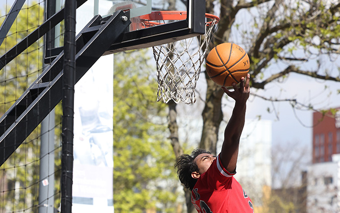 Student playing basketball