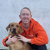 Ben Sweeney posing with his dog